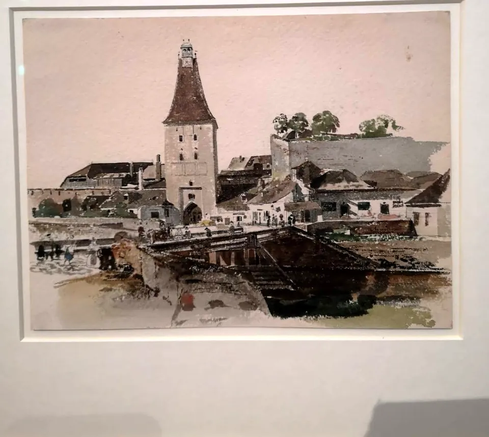 Aquarell eines Torturms mit Brücke in weißem Passepartout und Goldrahmen